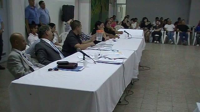 Los acusados y sus defensores